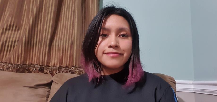 Photo of Alondra Rajxac, a girl with medium toned skin, brown eyes, and straight black shoulder length hair with purple tips