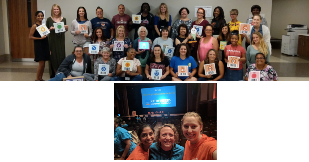 Group of teachers posing and holding up signs together at a conference